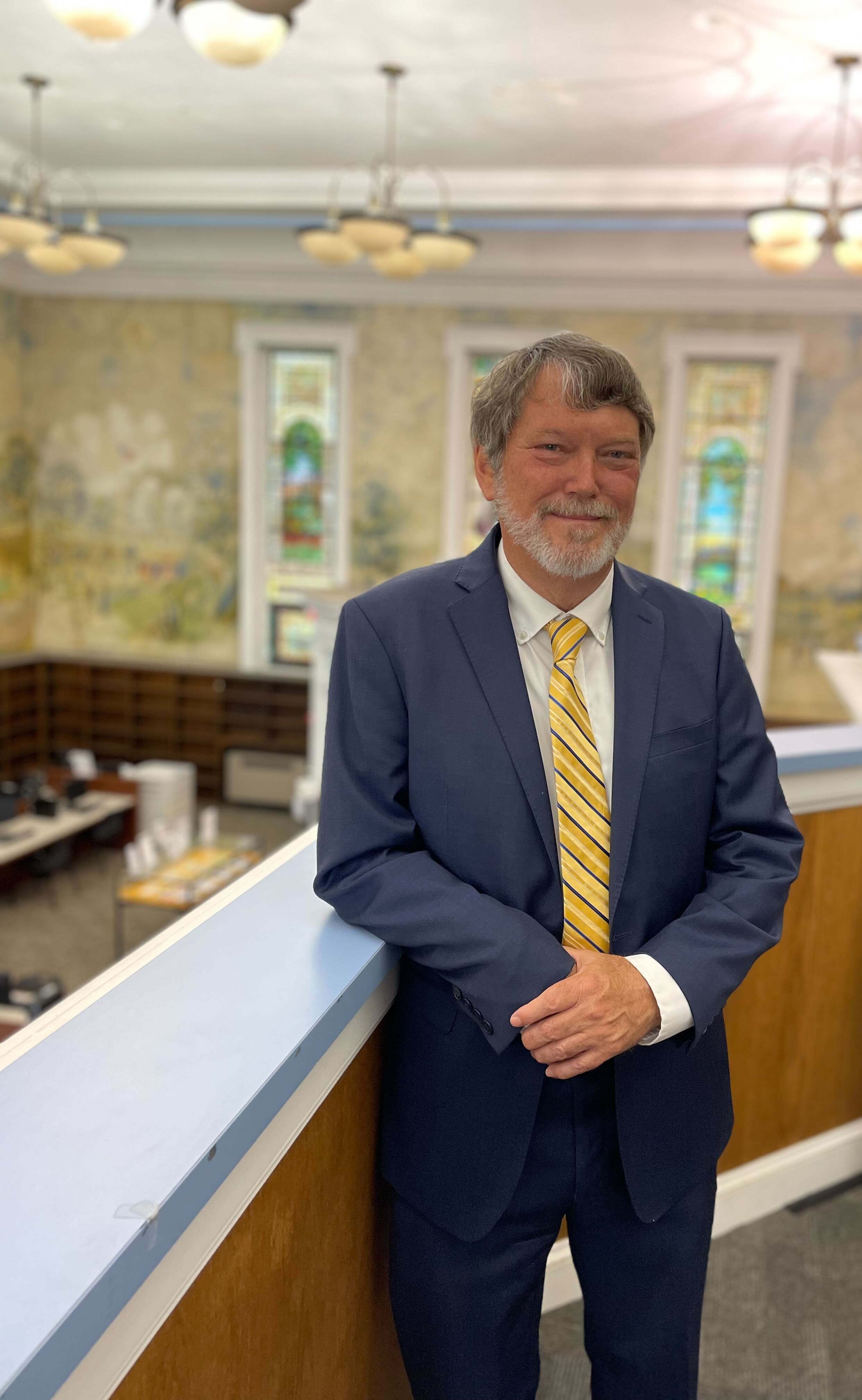 Carey Hatch overlooking the Dewey Library murals