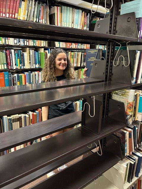 Adriana Grullon in the stacks