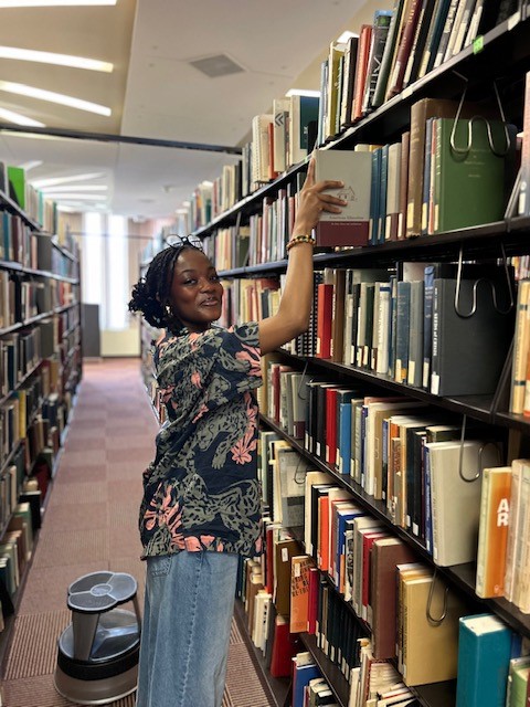 Layaan Roufai in the stacks