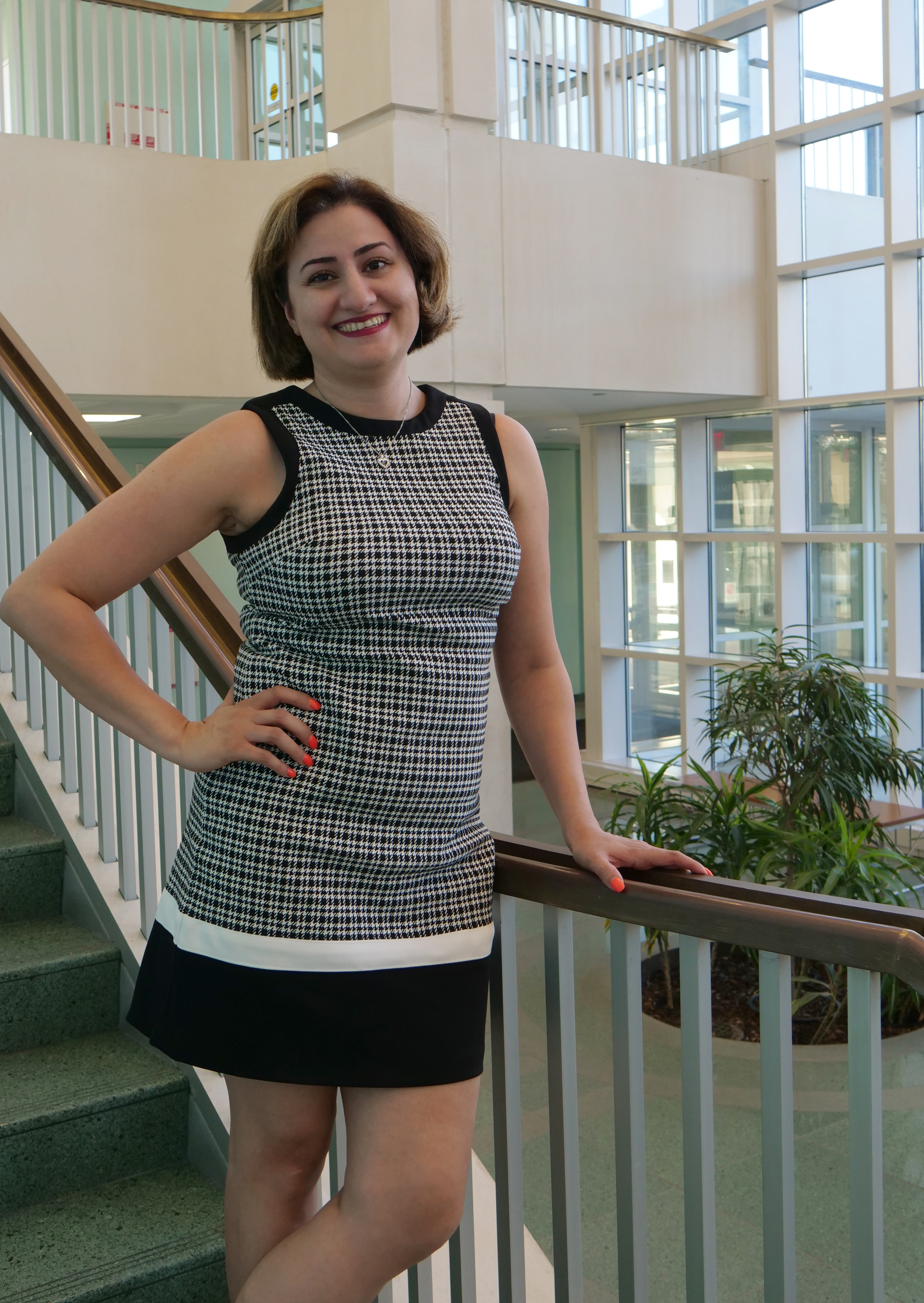 Seti Keshmiripour, Director of Academic Success, on the steps overlooking the Science Library