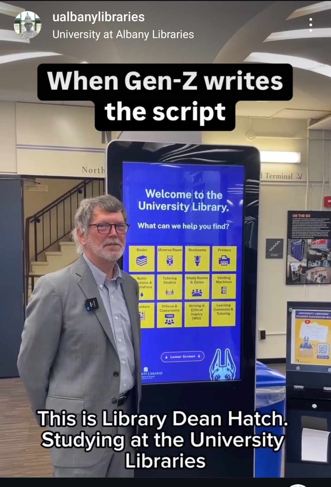 Screen cap of Gen-Z writes the script with Dean Hatch posing next to a kiosk