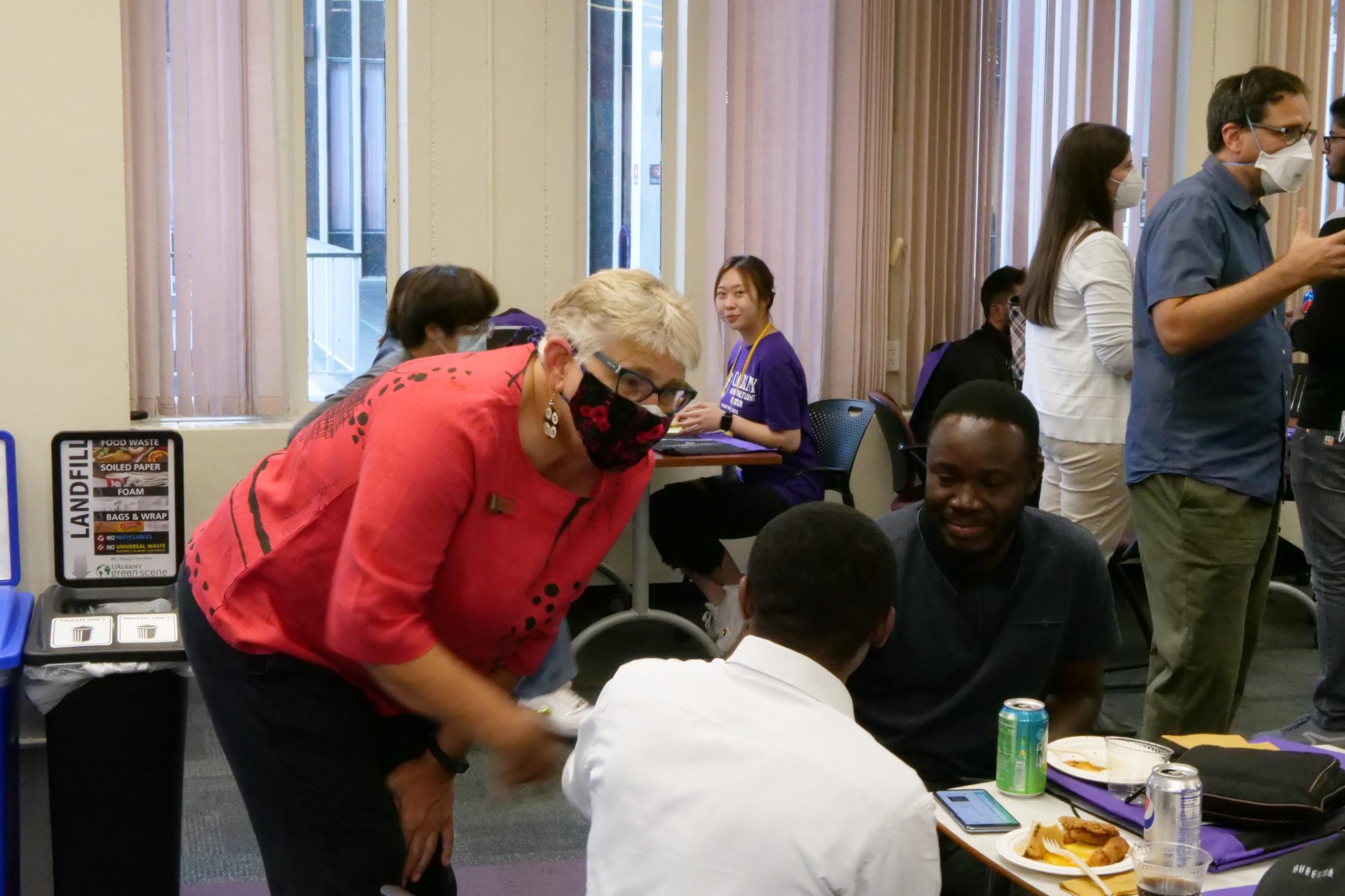 Deborah LaFond (left) mingles with students